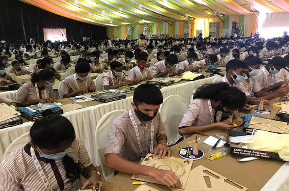 Students assembling paper dish antenna 1